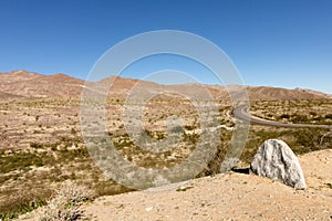 Stark dry southern California desert with blue sky, lonely empty and desolate, adventure hiking camping solitude, peaceful