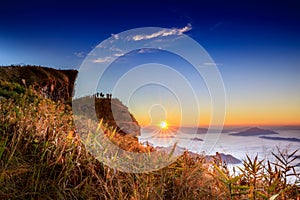 Starlight Sunrise scene with the peak of mountain called Phu Chifa with Fog over the city below photo