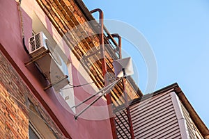 Starlink satellite dish, an internet constellation operated by SpaceX, is installed on the wall of an apartment building