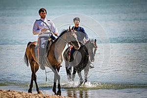STAROCHERKASSK, RUSSIA - CIRCA SEPTEMBER 2020: two young Don Cossack on horseback