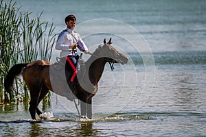 STAROCHERKASSK, RUSSIA - CIRCA SEPTEMBER 2020: a young Don Cossack on horseback