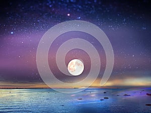 Starry blue night  moon sky at sea sunset background