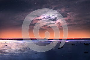 Starry night moon sea blue  pink cloudy sky sunset light reflection on water wave reflection on horizon boat skyline nature