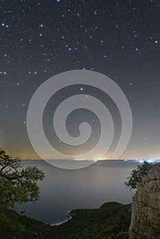 Starry skies above a beach