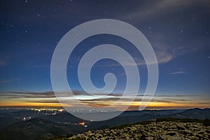 Starry sky before dawn in the mountains