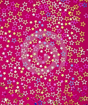 Stars background - Birthday background with colorful confetti. Rhodamine red color in foamy