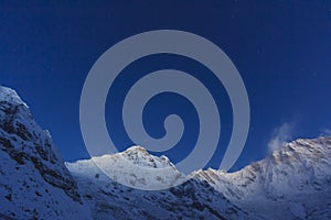 Stars and blue sky at Himalaya Annapurna snow mountain, Nepal