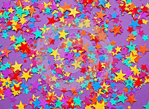 Stars confetti on a purple background