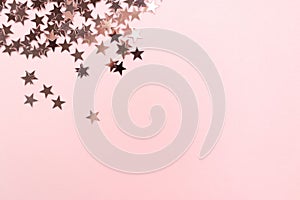 Stars glitter scattered on pink pastel background