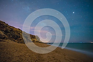 The stars in a perfect night in a beach