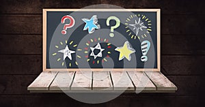 Stars and question marks on blackboard