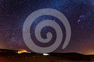 Stars sky night over camping tourist site, desert Israel.
