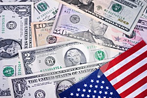 The stars and stripes with dollar bills of the USA. Money, cash background. Financial concept.