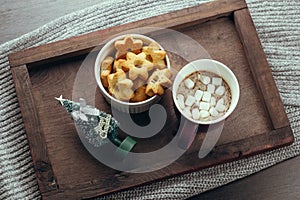 starshaped cookies,hot chocolate and bauble evergreen tree