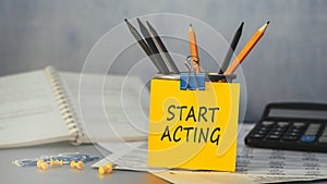 Start Acting - concept of text on sticky note. Work and study concept