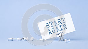 Start Again - concept of text on business card. Work and study concept