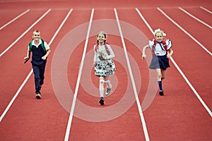 Start. Back to school, kids and education concept. Girls and boy dressed in school uniform as elementary student