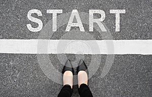 Start background, top view. Selfie of feet and legs in black high heels shoes on pathway. Businesswoman on starting line new