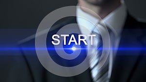 Start, businessman in official suit touching screen, first steps, beginning