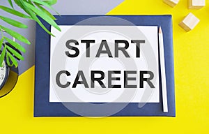 Start Career concept written on white paper above Notebook