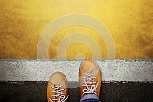 Start and Challenge Concept. a Man on Casual Leather Shoes Steps into the Start Line, Get Ready to Moving Forward or take a Chance photo