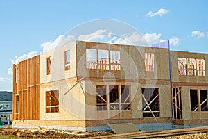 start of construction of plywood house real new wall wood material frame stud labor