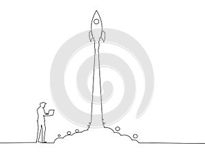 Start doing business. A businessman is working on launching a rocket