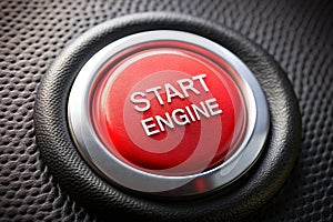 Start engine red blank button on black plastic background