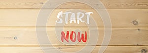 Start now symbol. Concept words Start now on beautiful wooden wall. Beautiful wooden wall background. Business marketing,