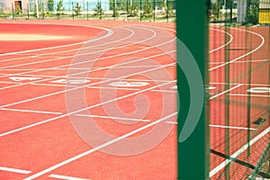 Start of red athletic track with numbers