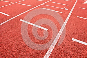 Start. Red running racetrack on the outdoor athletic stadium