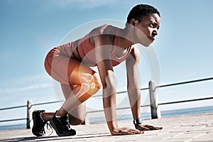 Start, running and race with black woman at beach for training, endurance and marathon. Energy, performance. and sports