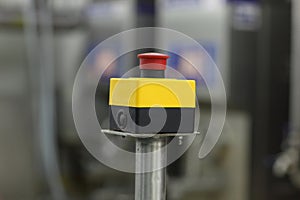 Start - stop button on industrial device in plant