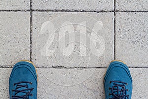 Start to new year 2016 - top view of man walking on the road