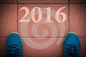 Start to new year 2016 - top view of man walking on the road