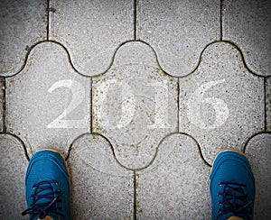 Start to new year 2016 - top view of man walking on the road