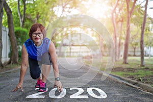 Start to new year 2020 plans goals Healthy way of life Senior asian woman happy jogging running