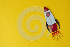 Start up business concept. Boost or increase incomes, salary. Drawn rocket on colorful yellow background. Copy space