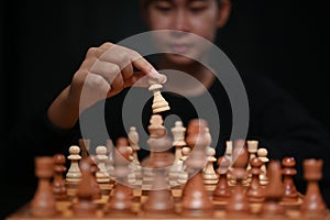 Start up business woman  making the first move in a chess game. Business strategy and management concept.