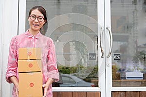 Start up small business owner holding parcel box at workplace. f