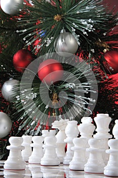 Start. White chess in Christmas decoration