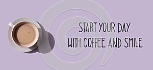 Start your day with coffee and smile. Text and white cup on purple background