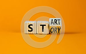 Start your story symbol. Turned the wooden cube and changed the concept word Start to Story. Beautiful orange table orange