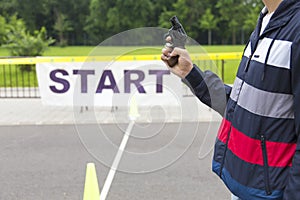 The start line and the starter with his pistol