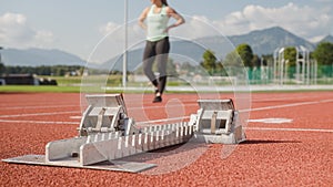 Starting block device placed on the athletics track, close up shot