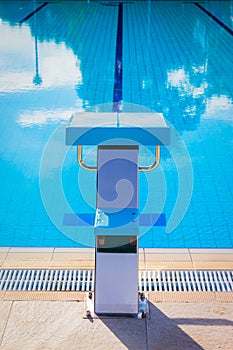 Starting block at the edge of a swimming pool