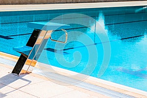 Starting block at the edge of a swimming pool