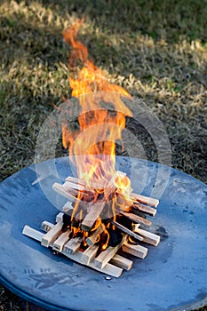 Starting the camp fire with kindling