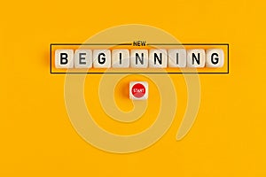 Starting a new beginning concept. The word new beginning on wooden cubes with a start button