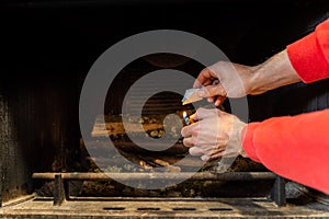 Starting up a fire inside a chimney with lighter cubes